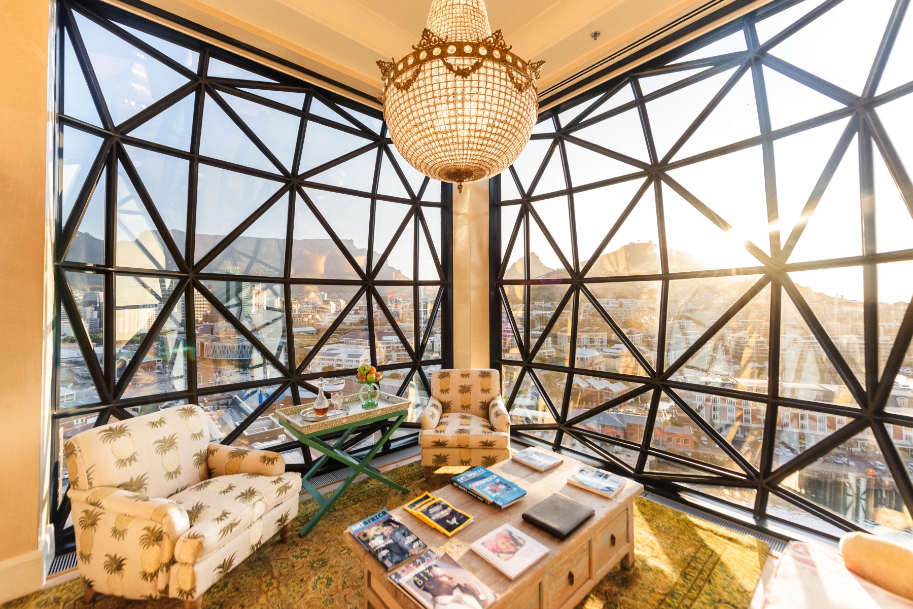 The-Silo-Hotel-penthouse A sunlit lounge with grand windows framing Table Mountain, inside one of the luxury hotels in Cape Town