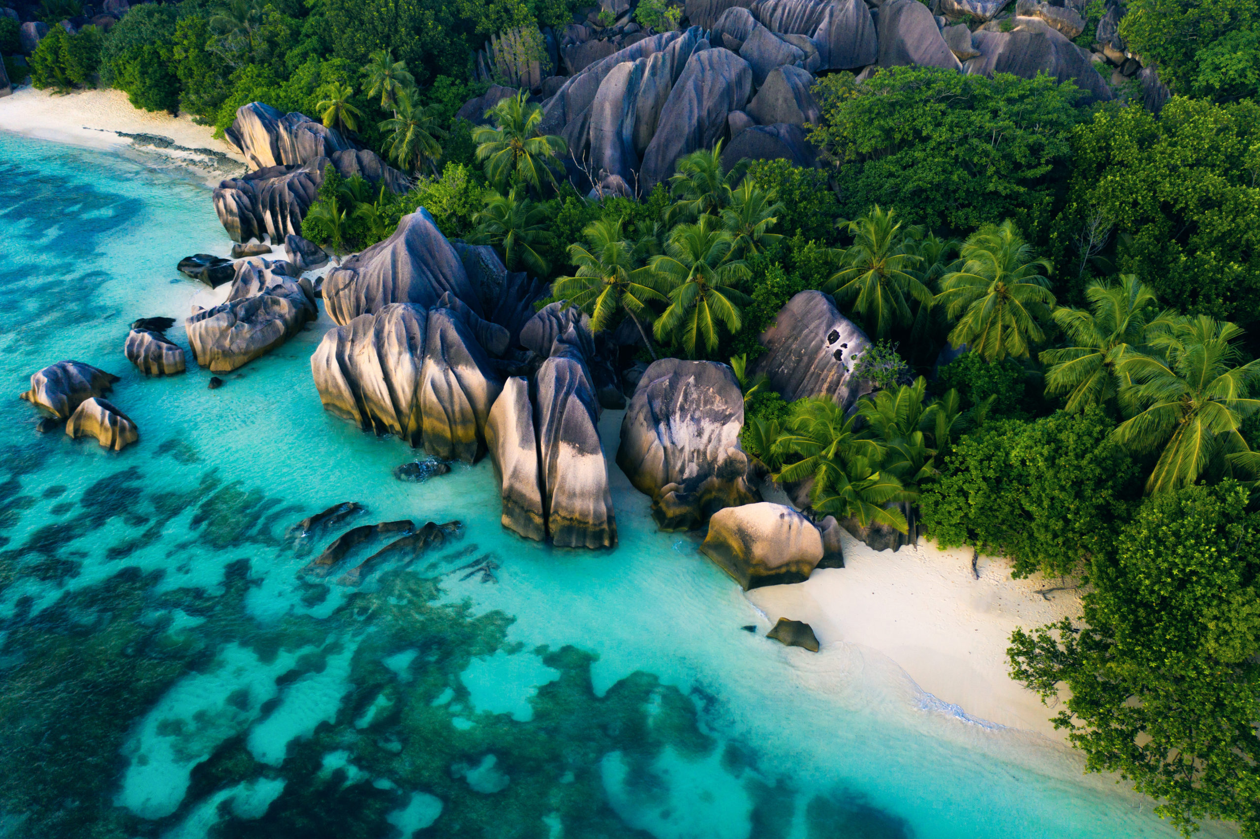 La Digue, seychelles Turquoise waters lap against granite boulders and palm-fringed sands, reflecting the island beauty of Africa in September.